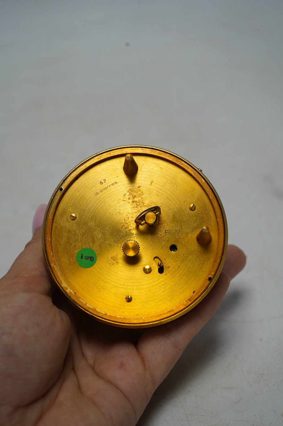 A 1950's/60's Jaeger travelling alarm timepiece, 7cm diameter. Condition - some light surface scratches, otherwise good. Winds, not ticking.